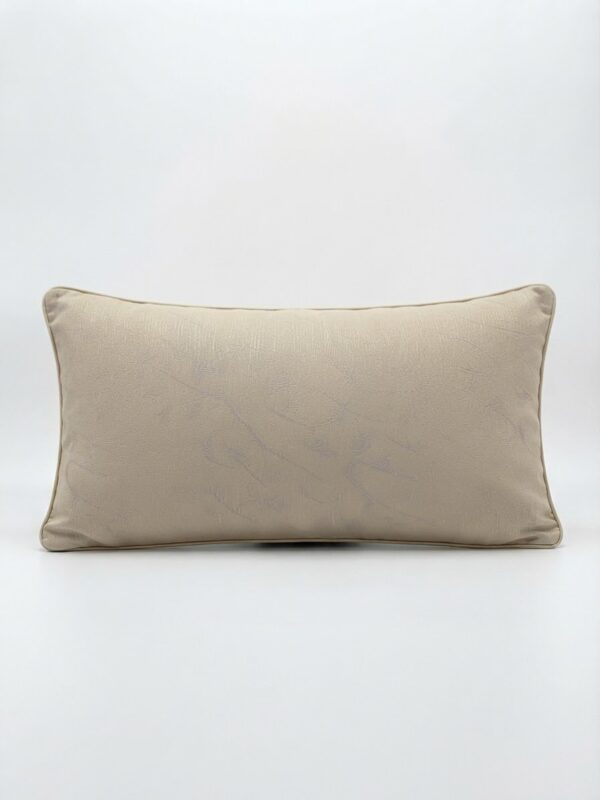 Coussin beige motif bleu